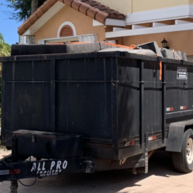 black dump truck with junk inside slidell la